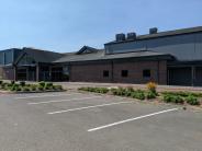 This is a photo of the parking lot and High School commons entrance.